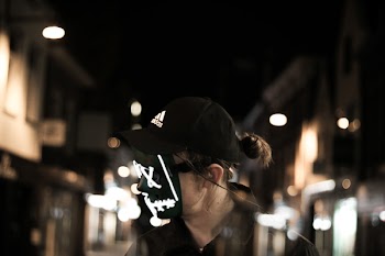 Selective Focus Photography of Person Wearing Mask and Cap