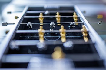 Selective Focus Photography of Playing Soccer Table