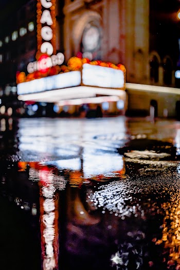 Selective Focus Photography of Puddle on Roadway