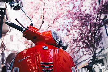 Selective Focus Photography of Red Motor Scooter