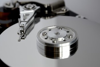 Selective Focus Photography of Round Gray Metal Part