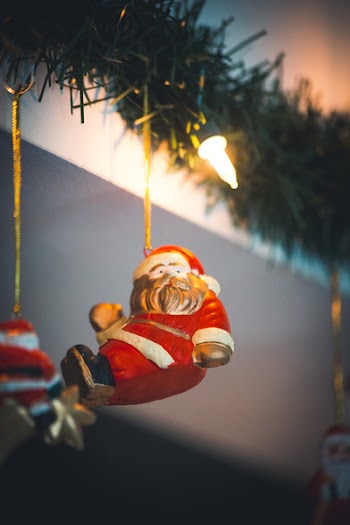 Selective Focus Photography of Santa Clause Hanging Decor