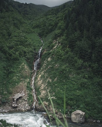 Selective Focus Photography Of Small Waterfalls