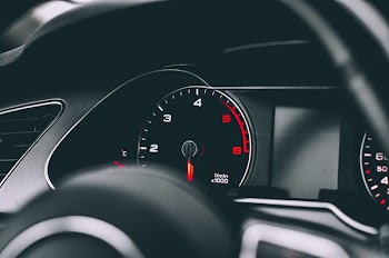 selective focus photography of speedometer