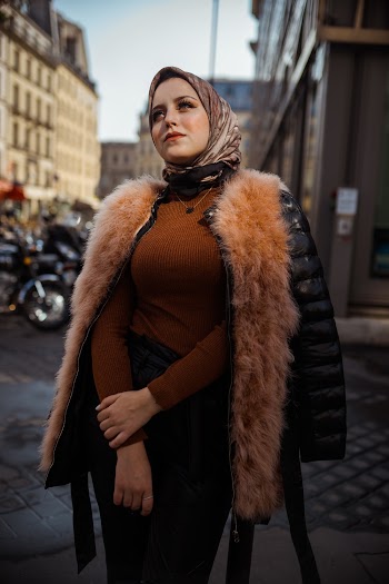 Selective Focus Photography of Standing Between Buildings