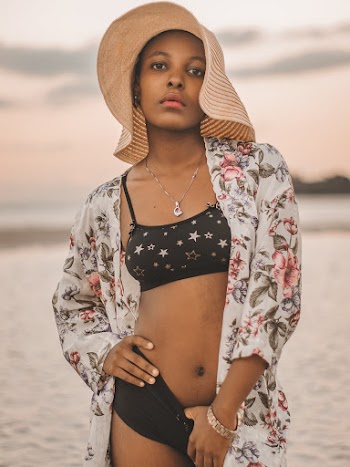 Selective Focus Photography of Standing Woman Wearing Black Bikini and Brown Sun Hat