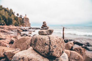 selective focus photography of stone balance