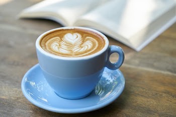 Selective Focus Photography of Teacup With Cafe Latte