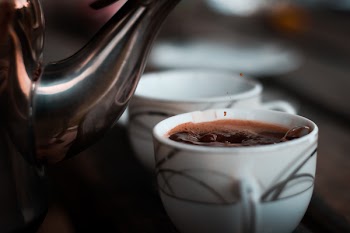 Selective Focus Photography of Teacup With Coffee