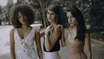 Selective Focus Photography of Three Woman Standing Near Trees