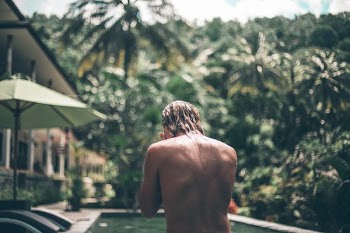 selective focus photography of topless woman during daytime