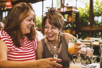 Selective Focus Photography of Two Smiling Women