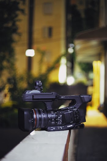 Selective Focus Photography of Video Camera on White Pavement