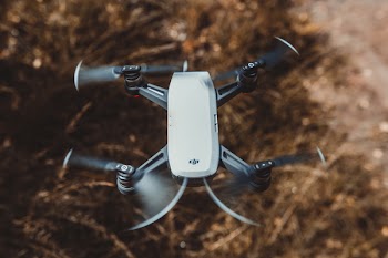 Selective Focus Photography of White and Black Quad Copter