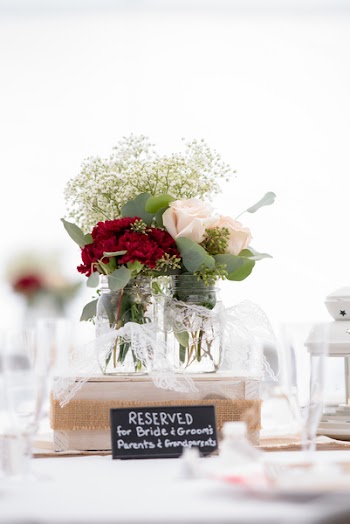 Selective Focus Photography of White and Red Hybrid Tea Rose Flowers Bouquet in Clear Glass Jar on Table