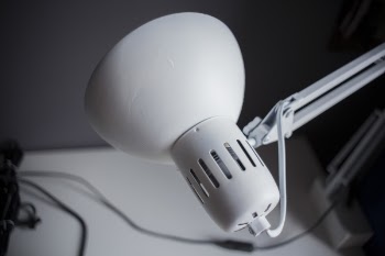 Selective Focus Photography of White Cantilever Lamp