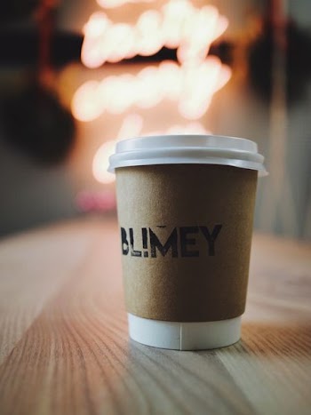 selective focus photography of white disposable cup