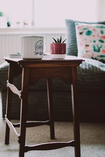 Selective Focus Photography of White Mug on Wooden Stool