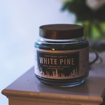 Selective Focus Photography of White Pine Soy Candle