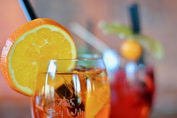 Selective Focus Photography of Wine Glass With Orange Juice