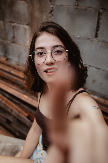 Selective Focus Photography of Woman About to Touch Camera