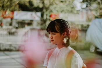 Selective Focus Photography Of Woman Carrying Backpack