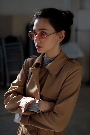Selective Focus Photography of Woman Crossing Arms