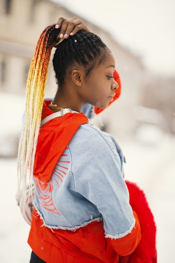 Selective Focus Photography Of Woman Holding Braided Hair