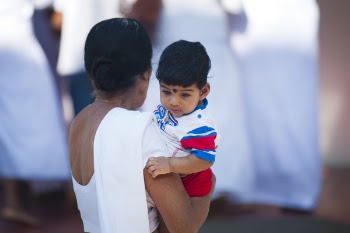 Selective Focus Photography of Woman Holding Child