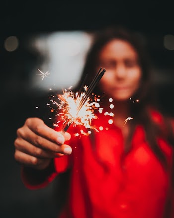 Selective Focus Photography Of Woman Holding Fireworks