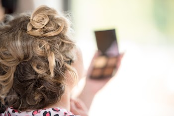 Selective Focus Photography Of Woman Holding Makeup Palette