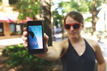 Selective Focus Photography of Woman Holding Turned on Iphone 5 Displaying 5:26 Time