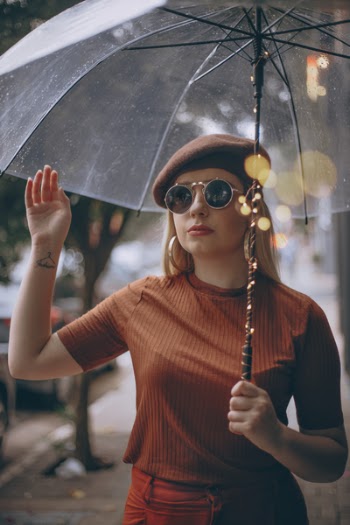Selective Focus Photography of Woman Holding Umbrella
