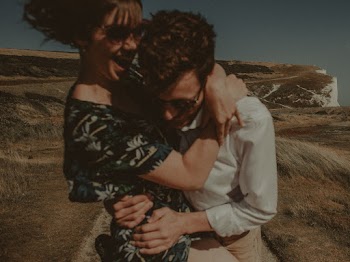 Selective Focus Photography of Woman Hugging Man