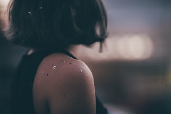 Selective Focus Photography of Woman in Black Sleeveless Top