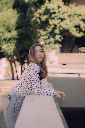 Selective Focus Photography Of Woman In Long Sleeved Shirt 