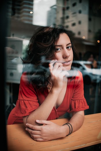 Selective Focus Photography of Woman in Red Dress