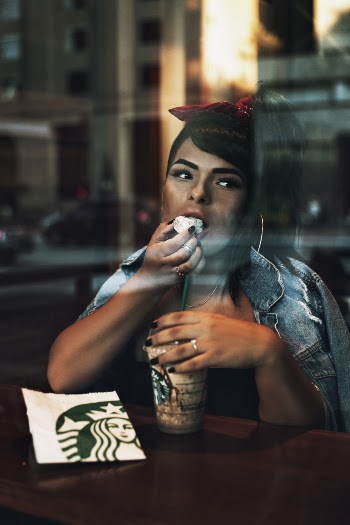 Selective Focus Photography of Woman in Starbucks Cafe
