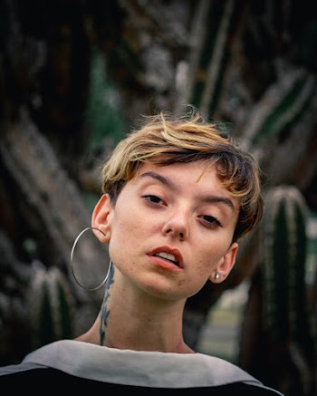 Selective Focus Photography of Woman in White Top