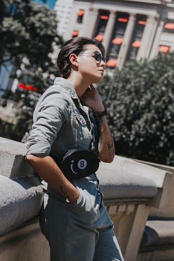 Selective Focus Photography of Woman Leaning Concrete Wall