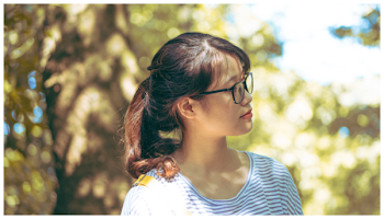 Selective Focus Photography of Woman Looking at Right Side