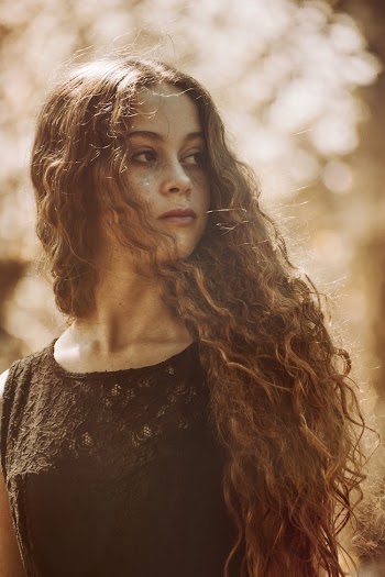 Selective Focus Photography Of Woman Looking Sideways