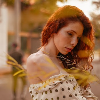 Selective Focus Photography of Woman Near Outdoor