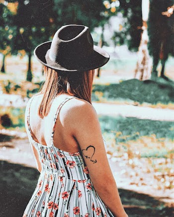 Selective Focus Photography of Woman Near Trees