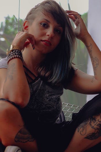 Selective Focus Photography of Woman Sitting on Wire Chair