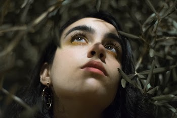 Selective Focus Photography of Woman Surrounded by Plant