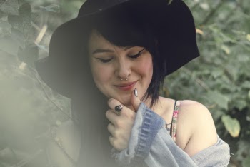 Selective Focus Photography Of Woman Touching Her Chin