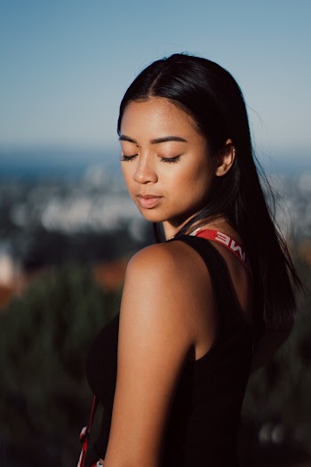 Selective Focus Photography Of Woman Wearing Black Tank Top With Eyes Close