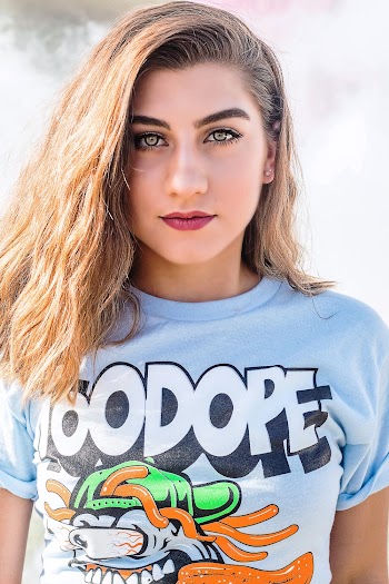Selective Focus Photography of Woman Wearing Blue and White Crew-neck T-shirt