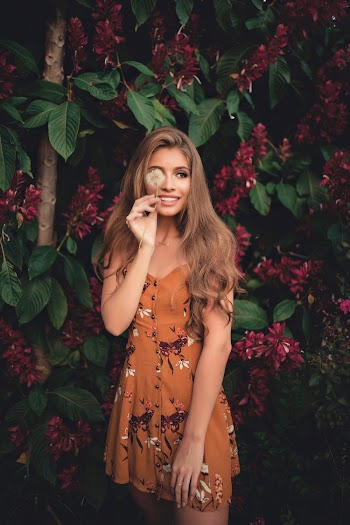 Selective Focus Photography Of Woman Wearing Brown Floral Dress
